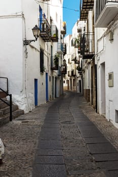 A street in the village of Peñíscola,Spain. Vertical image.