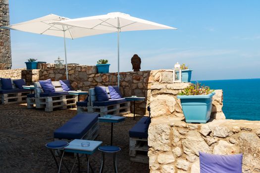 Restaurant with summer terrace and sea views. Horizontal image.