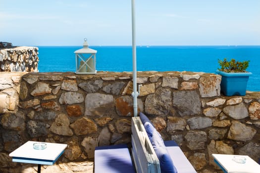 Restaurant with summer terrace and sea views. Horizontal image.