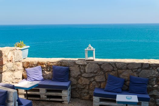 Restaurant with summer terrace and sea views. Horizontal image.