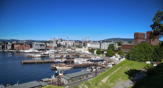 OSLO, NORWAY – AUGUST 17, 2016: View of panorama on Oslo Harbour and Oslo City Hall from Akershus fortress in Oslo, Norway on August 17, 2016.