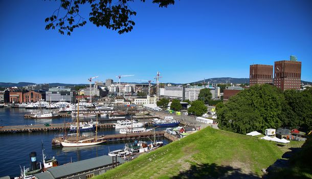 OSLO, NORWAY – AUGUST 17, 2016: View of panorama on Oslo Harbour and Oslo City Hall from Akershus fortress in Oslo, Norway on August 17, 2016.