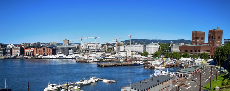 OSLO, NORWAY – AUGUST 17, 2016: View of panorama on Oslo Harbour and Oslo City Hall from Akershus fortress in Oslo, Norway on August 17, 2016.