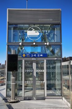 OSLO, NORWAY – AUGUST 17, 2016: View of Akrobaten pedestrian bridge  with modern business architecture and elevator lift that leads to the railway station street in Oslo, Norway on August 17, 2016.