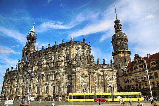 DRESDEN, GERMANY – AUGUST 13, 2016: Tourists walk on Theaterplatz and Majestic view on  Saxony Dresden Castle and Katholische Hofkirche in Dresden, State of Saxony, Germany on August 13, 2016.