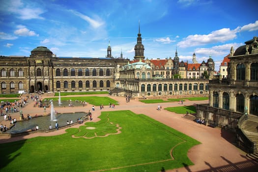 DRESDEN, GERMANY – AUGUST 13, 2016: Tourists walk and visit Dresdner Zwinger, rebuilt after the second world war, the palace is now the most visited monument  in Dresden, Germany on August 13, 2016.