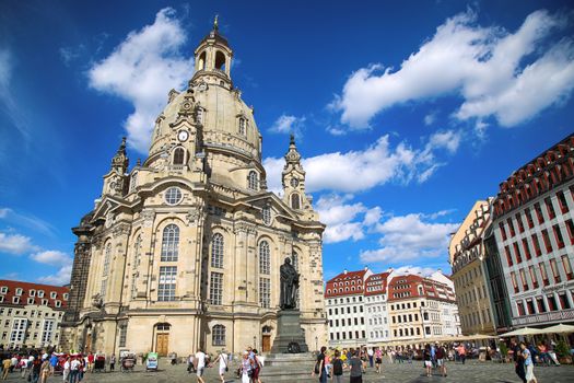 DRESDEN, GERMANY – AUGUST 13, 2016: People walk on Neumarkt Square at Frauenkirche (Our Lady church) in the center of Old town in Dresden, State of Saxony, Germany on August 13, 2016.