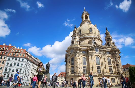 DRESDEN, GERMANY – AUGUST 13, 2016: People walk on Neumarkt Square at Frauenkirche (Our Lady church) in the center of Old town in Dresden, State of Saxony, Germany on August 13, 2016.