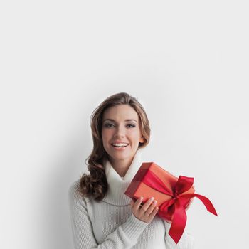 Woman hold christmas or new year decorated gift box