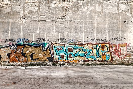 the wall decorated with colorful abstract graffiti