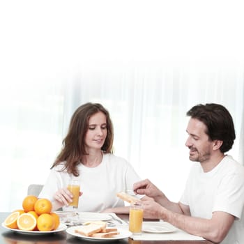 Couple having breakfast together at home 