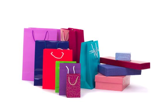 Colourful and bright shopping packages and boxes for gifts and presents isolated on white