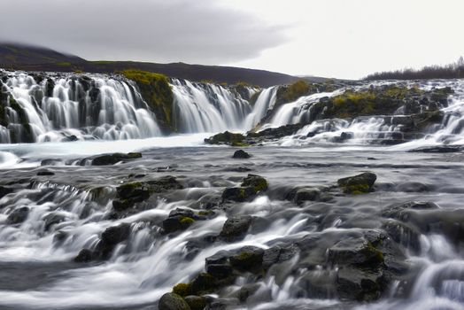 Bruarfoss is also called the blue waterfall and means “bridge over waterfall”. The river Bruara flows down over 2-3 meter and ends in a U shape slot.