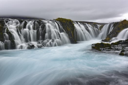 Bruarfoss is also called the blue waterfall and means “bridge over waterfall”. The river Bruara flows down over 2-3 meter and ends in a U shape slot.