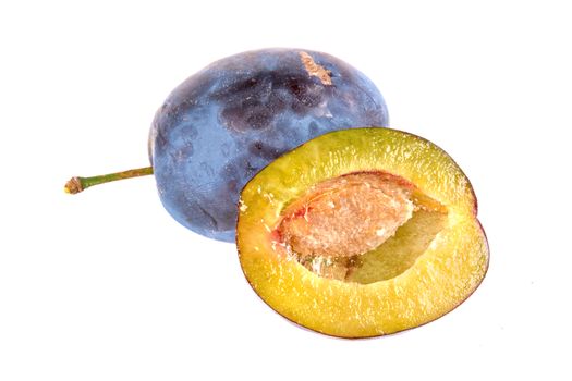 Cut plum isolated on a white background
