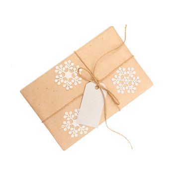 gift box of kraft paper with a tag for text on a white background.