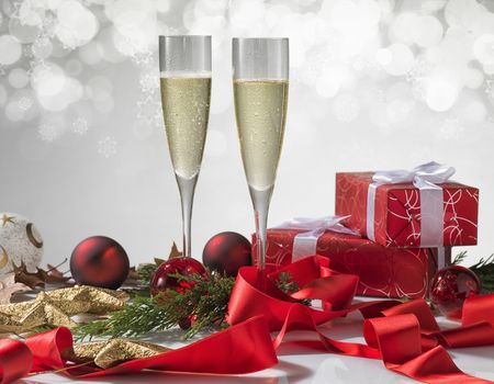 Champagne glasses, Christmas balls, gift and other symbols of holiday