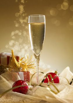 Glass of champagne with gift box