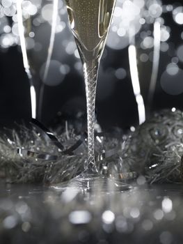 Three luxury champagne glasses on a black background