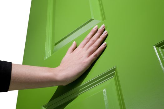 Woman pushes a green door open with her hand
