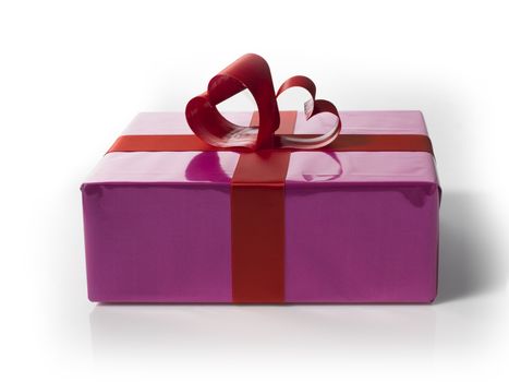 Giftbox with red hart shaped laces on a white background