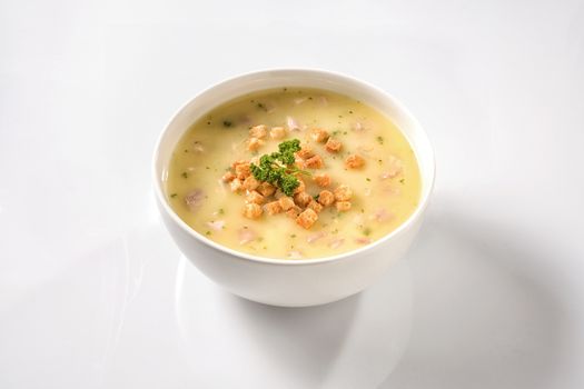 Fresh vegetable chicken stew with croutons on white background