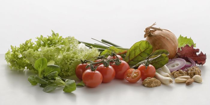 group of vegetables in front of white background