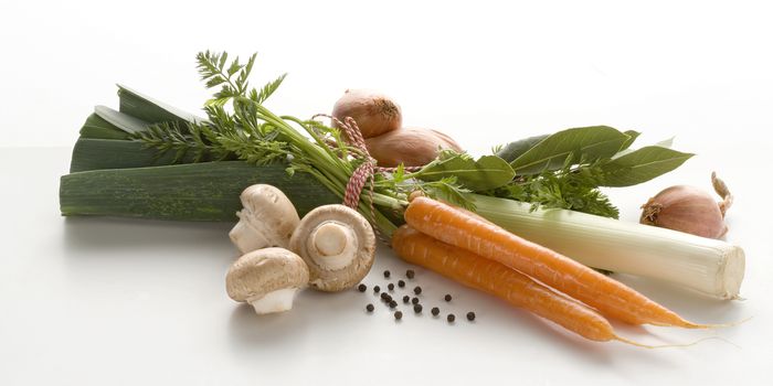 group of vegetables. Carrots, mushrooms and unions in front of