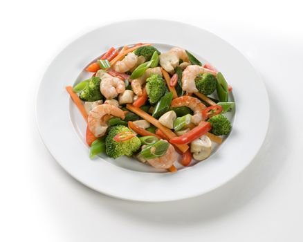 fresh shrimps and vegetables on white table.