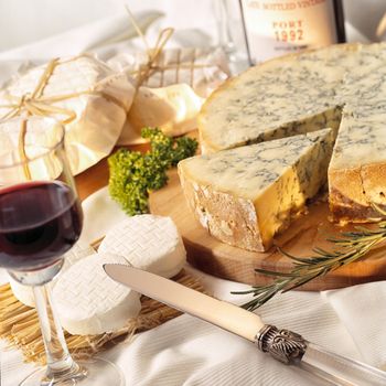 Various types of cheese set with grapes and nuts