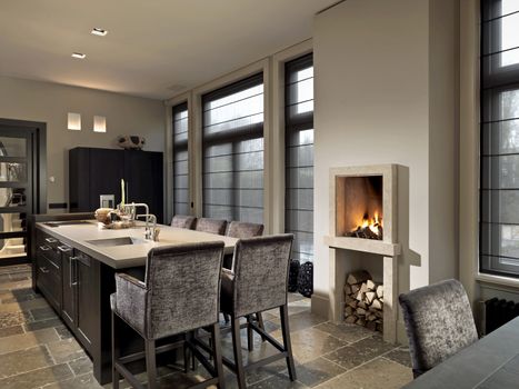 Fireplace in kitchen with table