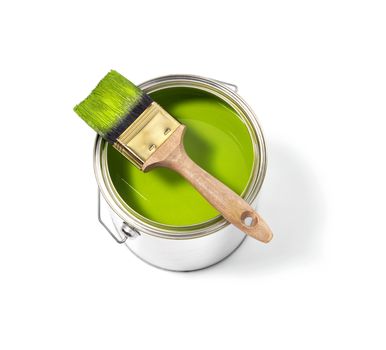 Green paint tin can with brush on top on a white background