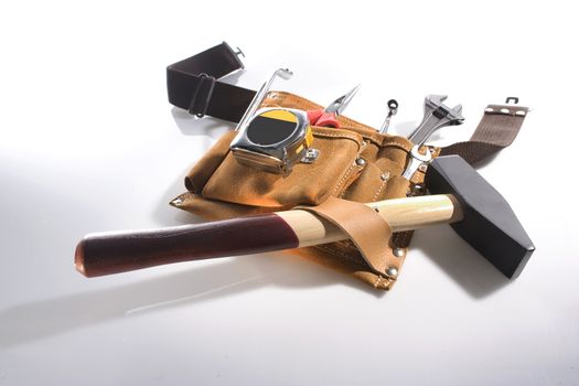Tool belt with different tools on isolated white background