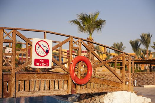 Swimming pool sharm el sheikh, Egypt. No diving sign on bridge