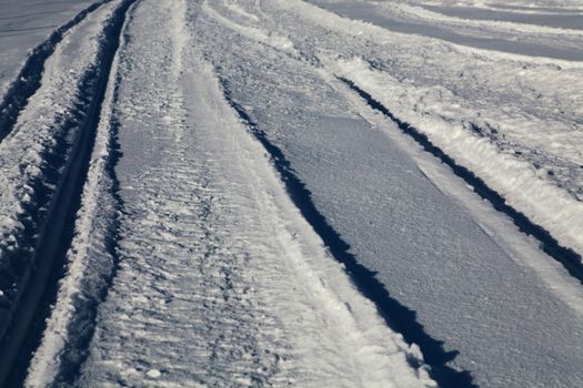 Snow covered path lined at december