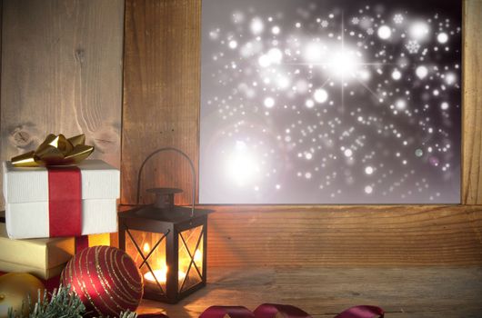 Christmas gifts next to a window with bokeh lights outside