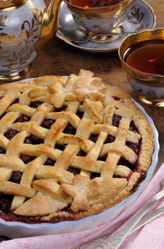 cherry pie dough with decorative ornaments in  roasting pan