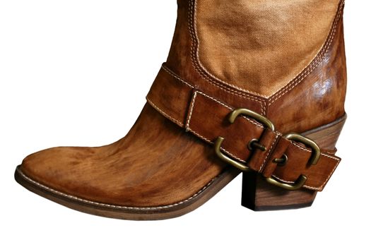 Female boot of the cowboy on a white background