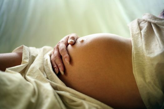 The pregnant woman on the ninth month. The girl was born
