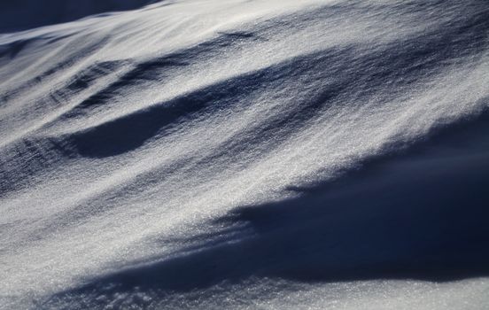 background of winter snow like barchan, shiny snowflake