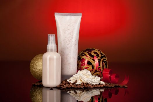 Bottle with cosmetic cream, New Year balls and coffee beans on a glass background