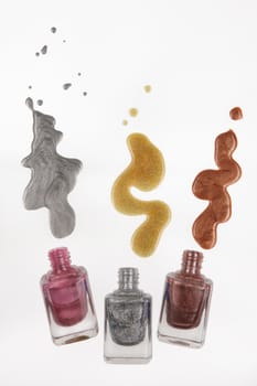 Three bottles with enamel on isolated background