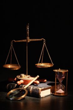 Vintage still life. Weight scale and tools on background with old books