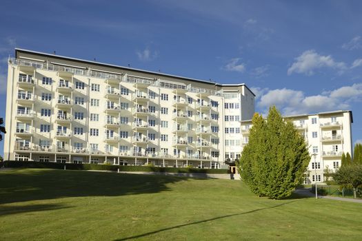 Swedish apartment block with blue sky.