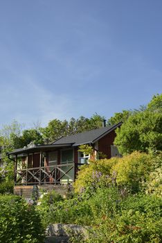 Idyllic cottage in botanical garden.