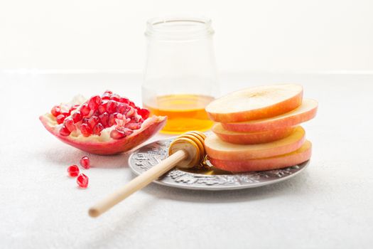Apples, pomegranate and honey for Rosh Hashanah .