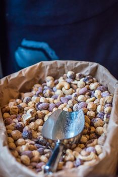 hazelnuts in a paper bag for sale