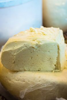 piece of delicious fresh white cheese at the exhibition