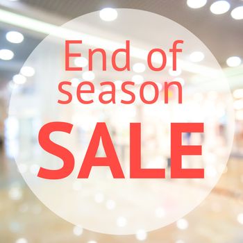 End of season sale sign over blurred store background. Design for shop and sale banners