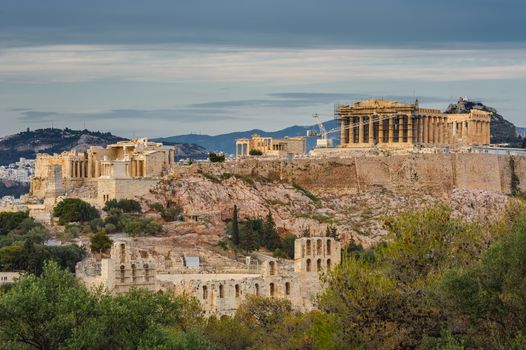 Ancient Acropolis in rays of sunset. Athens Greece. Copyspace.